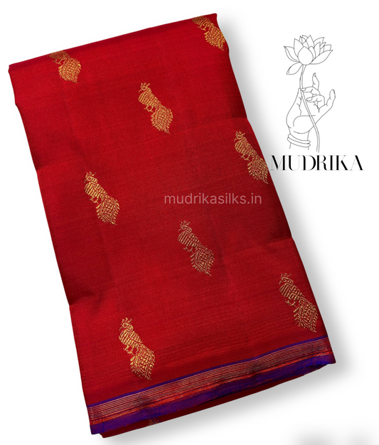 Red pure Kanchipattu saree with peacock motifs