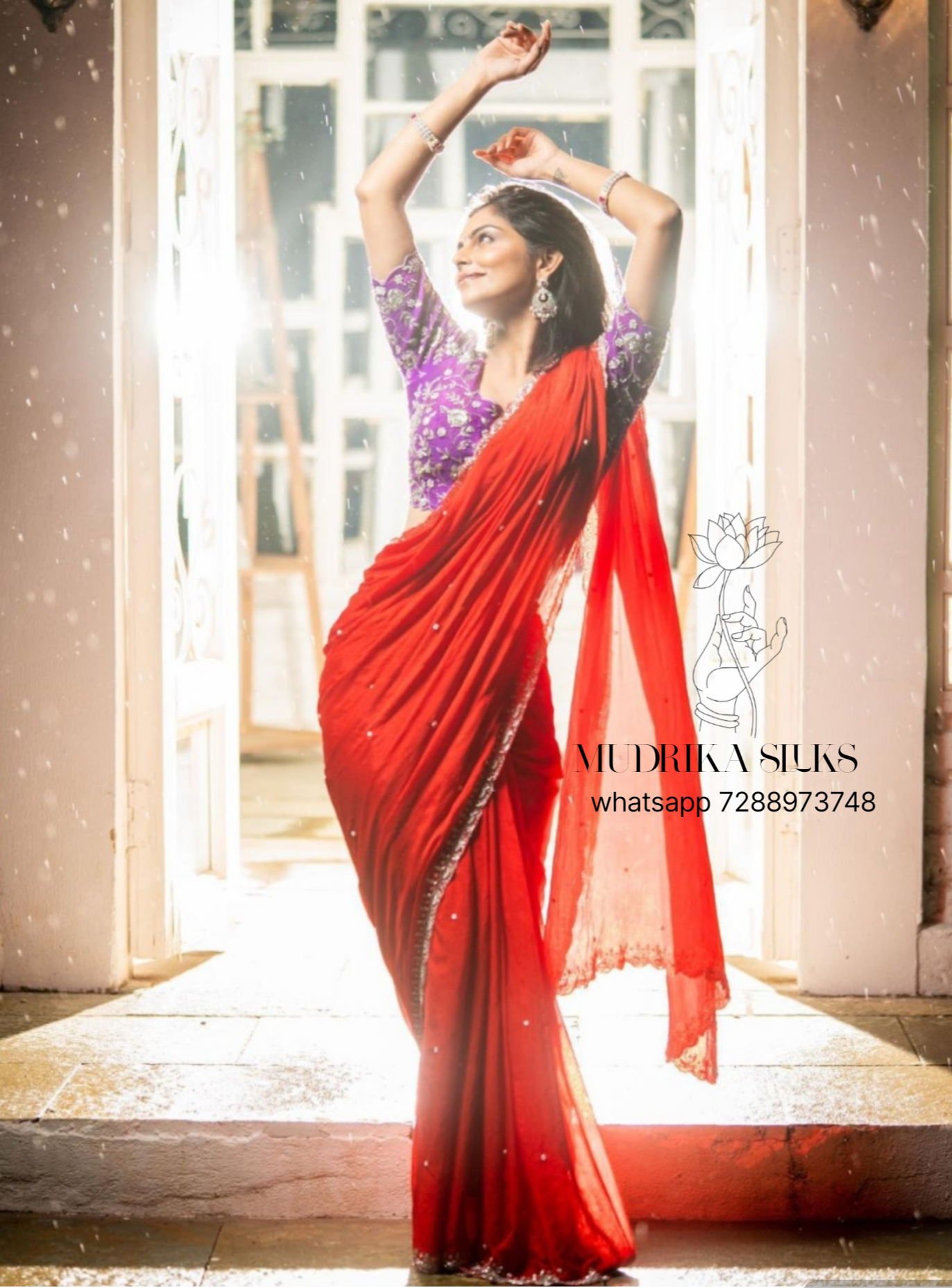 Red designer saree with intricately worked scallop border