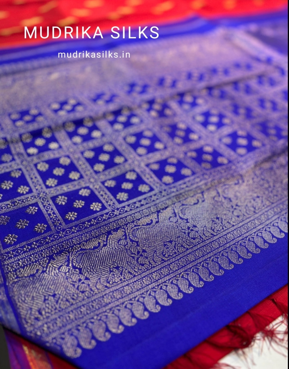 Red pure Kanchipattu saree with peacock motifs