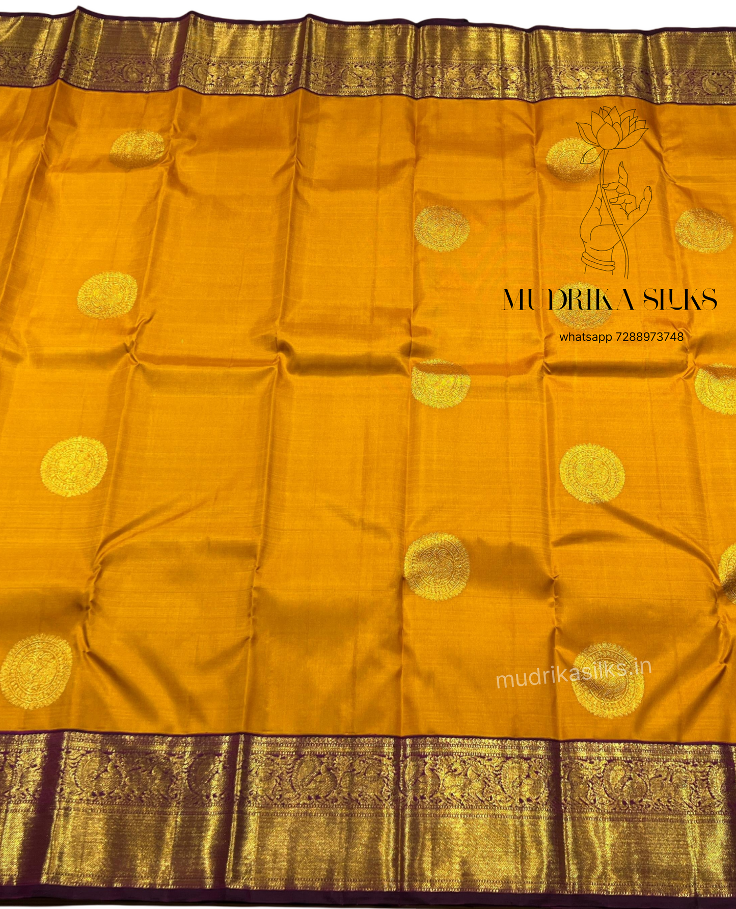 Mustard yellow Kanjivaram pattu sarees with jamun pink border