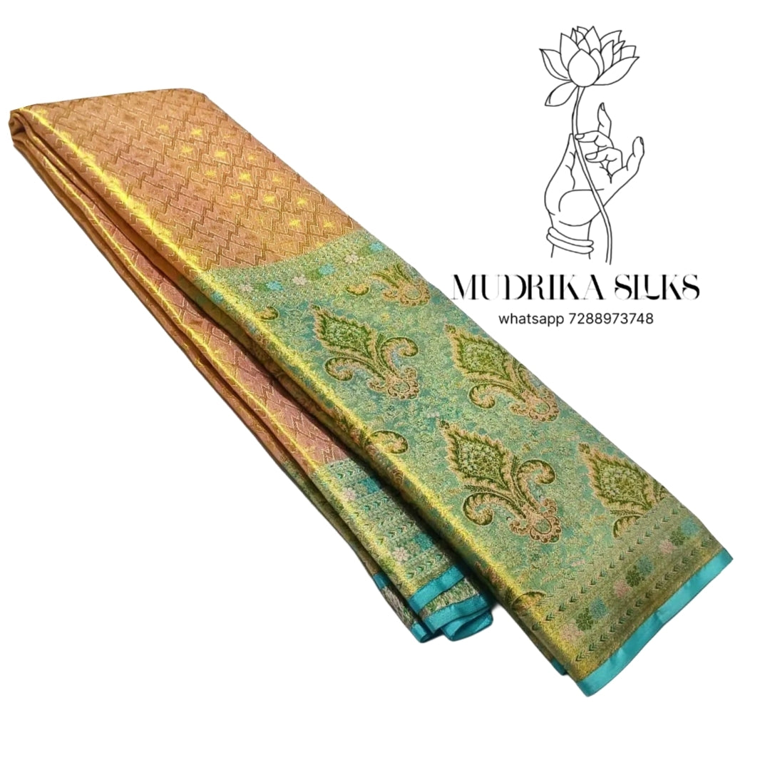 Peach tissue silk saree with aqua blue border